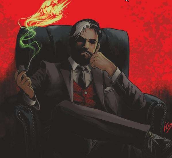 Hombre en traje, fondo rojo, sentado en sillón.